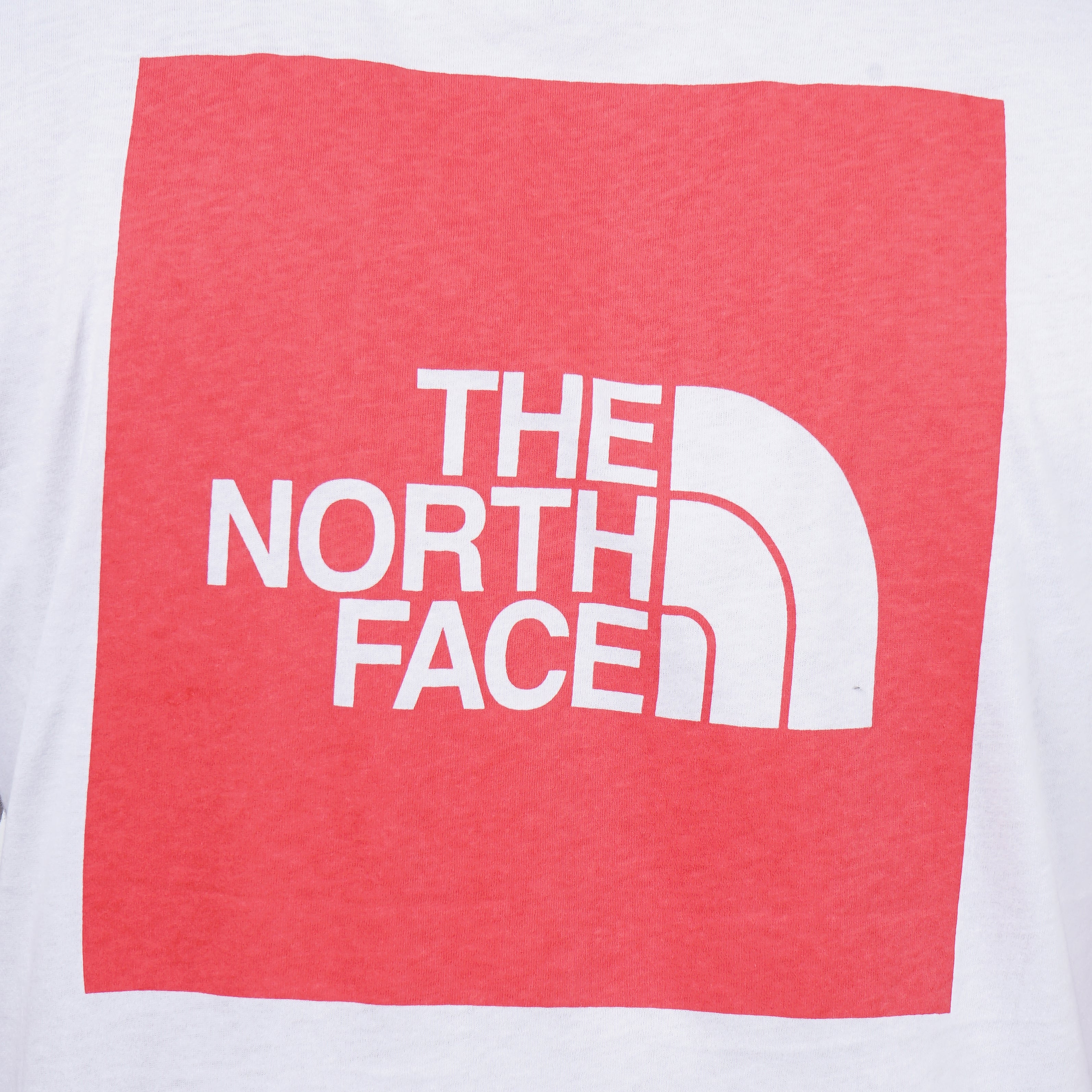 White t-shirt with red The North Face logo, outdoor apparel brand merchandise.